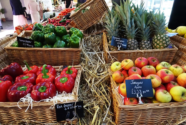 LIV Organic and Natural Food Market A range of fresh fruit and veg, including red peppers, apples, pineapples and green peppers