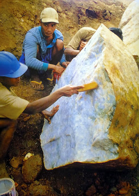 Huge lavender jade raw stone Huge lavender jade raw stone being cleaned in north Myanmar