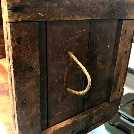side of crate with rope handle
