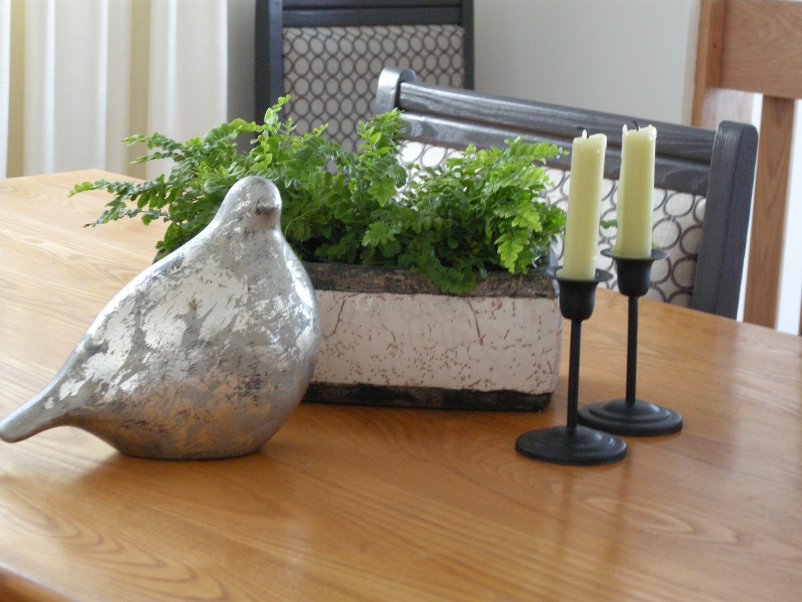 silver leaf bird, candles, boston ferns, trough planter, dining table, centrepiece