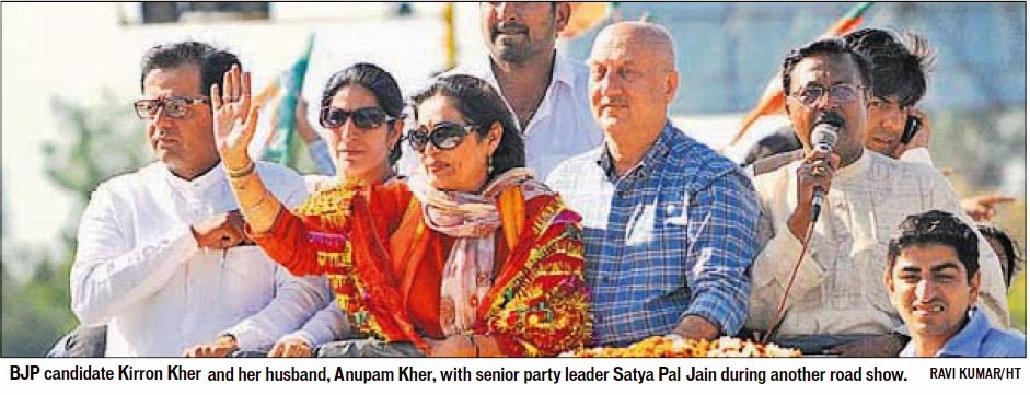 BJP candidate Kirron Kher and her husband, Anupam Kher, with senior party leader Satya Pal Jain during another road show. Ravi Kumar/HT