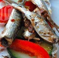 Receita para aprender como fazer sardinhas em conserva de alta qualidade. Foto do prato pronto para consumo.