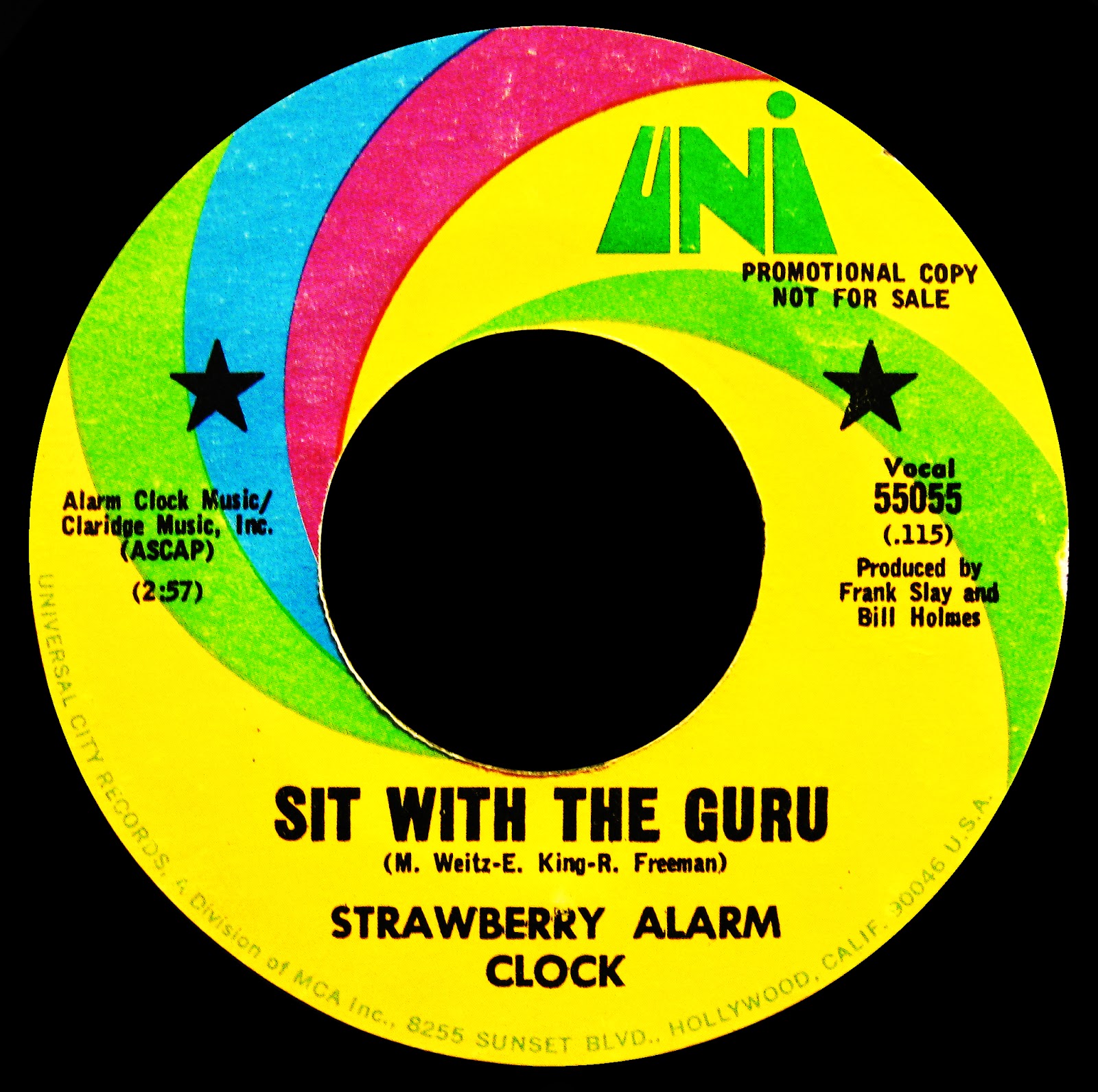 THE ROSE COLORED CORNER STRAWBERRY ALARM CLOCK SIT WITH THE GURU