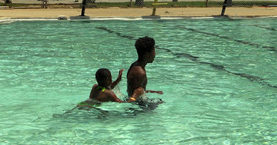 Swimmers at a community pool