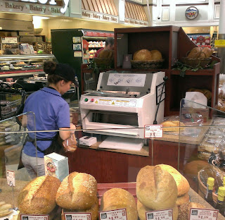 automatic bread slicer at a grocery store