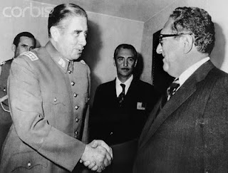 Kissinger and Pinochet shake hands