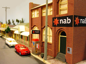 Quarter inch scale modern Australian town street scene with National Australia Bank building on the corner.