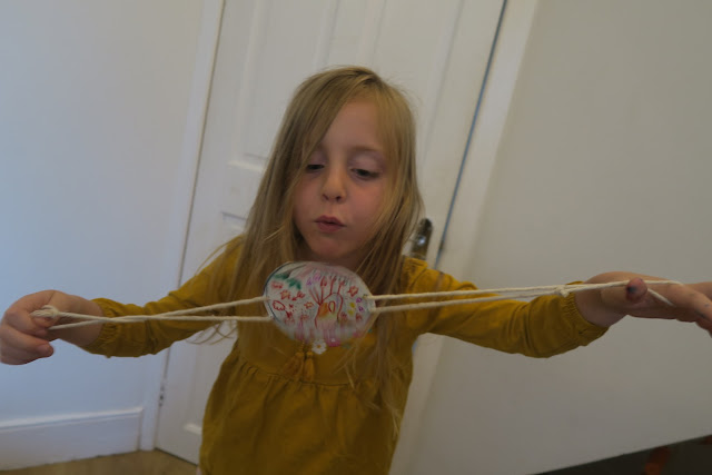 Lily blowing the spinner