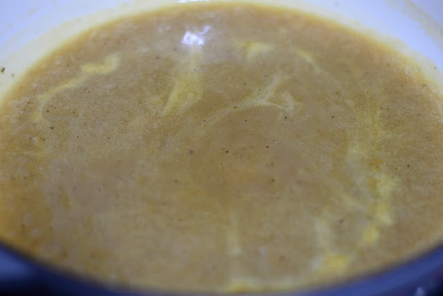 The broth and soup mixture in the skillet, coming to a boil. 