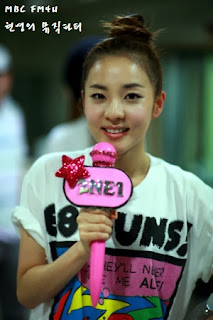 Sandara Park holding a pink microphone