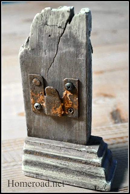 A reclaimed lumber and rusty hinge picture frame by Homeroad, featured at I Love That Junk