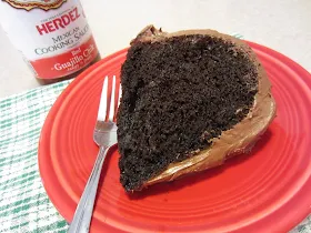 Slice of Easy Mexican Chocolate Cake by Renee's Kitchen Adventures on a red plate with a fork 