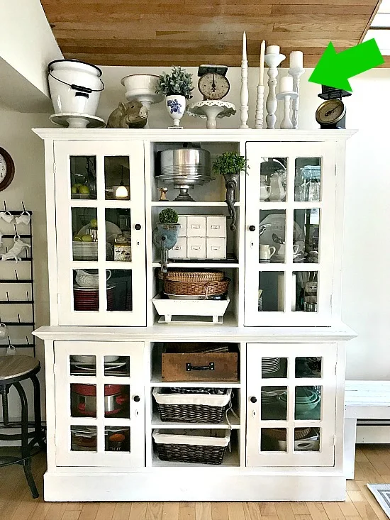 Farmhouse hutch with white candlestick collectionl