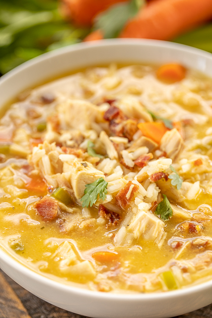 Crack Chicken and Rice Soup - this soup should come with a warning label! SO GOOD!!! Ready in 30 minutes! Chicken, cheese soup, chicken broth, celery, carrots, ranch mix, bacon, and rice. Everyone went back for seconds - even our super picky eaters! A great kid-friendly dinner!! We love this soup! #soup #bacon #chickenandricesoup #crackchicken Crack Chicken and Rice Soup - this soup should come with a warning label! SO GOOD!!! Ready in 30 minutes! Chicken, cheese soup, chicken broth, celery, carrots, ranch mix, bacon, and rice. Everyone went back for seconds - even our super picky eaters! A great kid-friendly dinner!! We love this soup! #soup #bacon #chickenandricesoup #crackchicken
