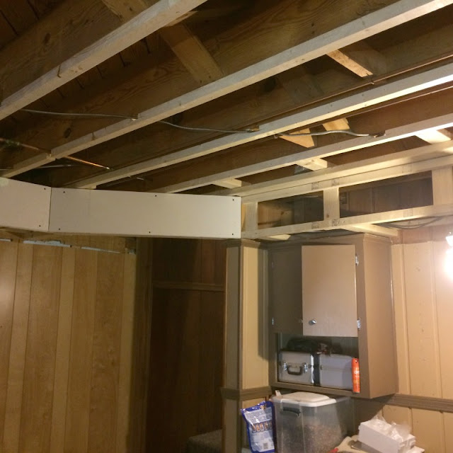 See what a difference drywall and lighting made in our basement!