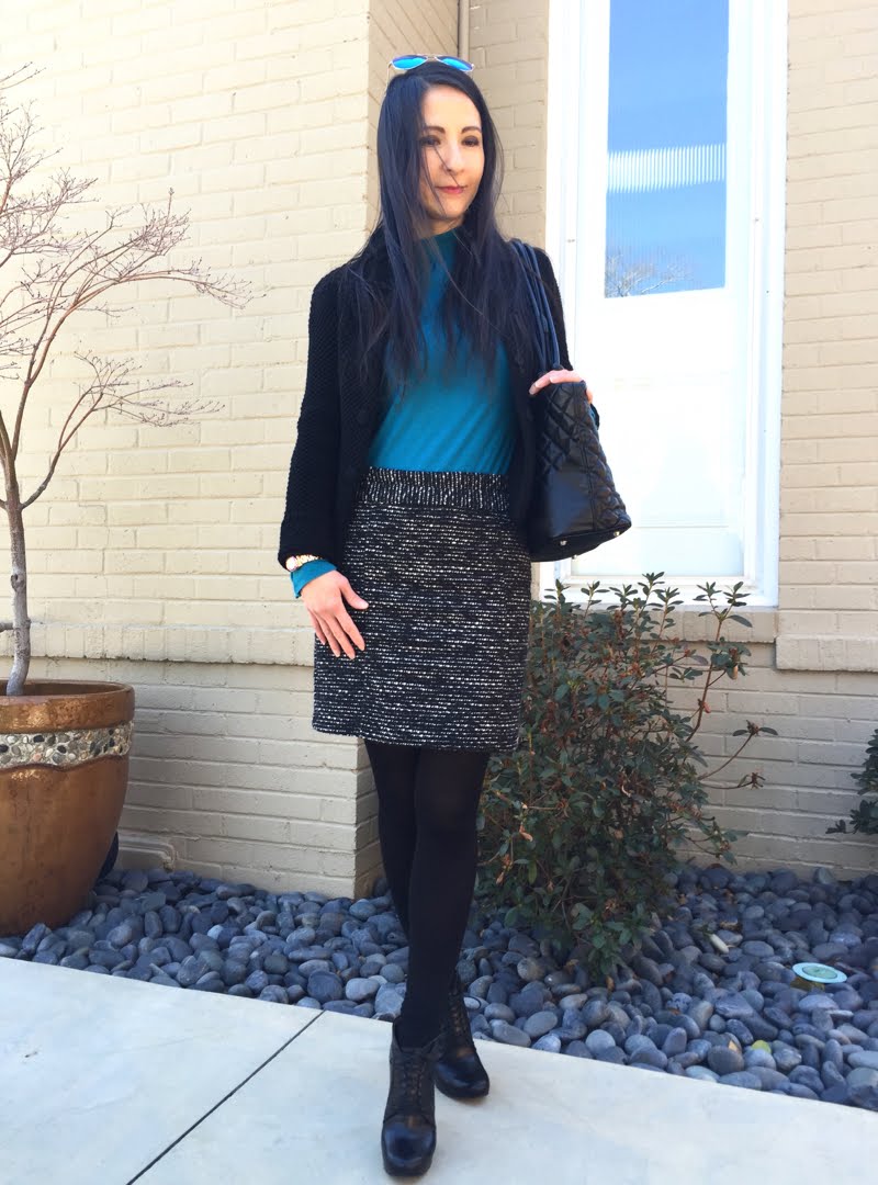 Winter blues outfit - Cloudy shot lightened. Winter blues outfit - wind blowing hair across face.