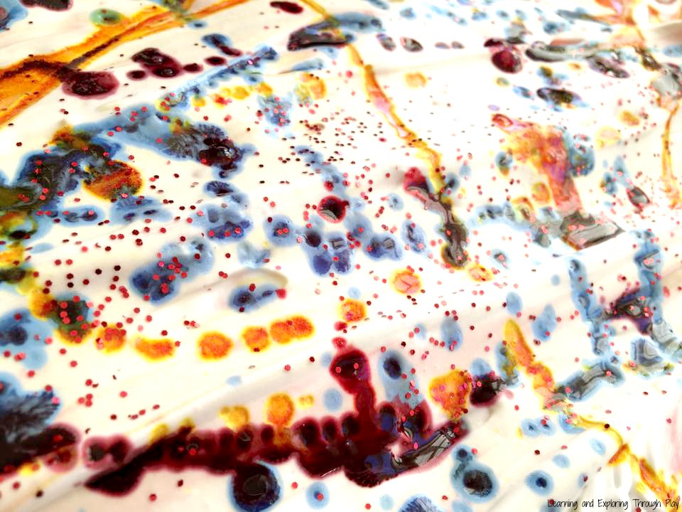 Learning and Exploring Through Play Shaving Foam Marbling Hearts