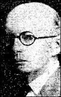 Dr. Guy E. Brewer Headshot clipped from a newspaper, showing a bald, middle-aged white man in 1/4 profile, looking grimly into the camera through round dark-rimmed eyeglasses