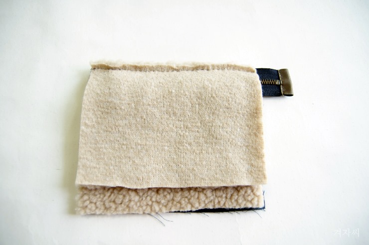 Small cosmetic pouch made of faux fur makeup bag mini wallet.