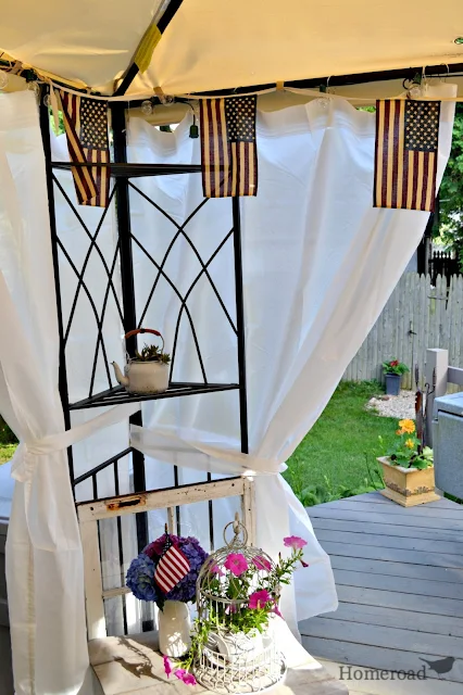 Outdoor gazebo with curtains hanging