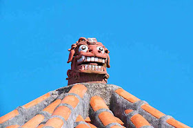 orange roof tiles, monster, dragon, blue sky