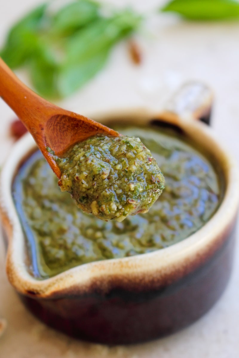 Pecan Basil Pesto is a twist on traditional pesto that uses pecans instead of pine nuts. It is super versatile and can be used in so many ways!  #pesto #pecans