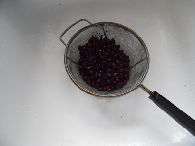 photo of black beans being rinsed and drained