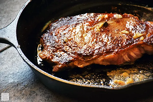 Sear the steaks in a cast iron skillet