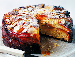 Plum, Almond and Ricotta Cake: Interesting layer cake of an almond, flour and ricotta batter sandwiched with jam that's topped with plums and slivered almonds before baking. Shown with a slice removed