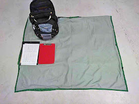 sleeping bag, backpack,clipboards, model releases