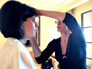 Dyana Aives of Inurface Makeup applying makeup to her client