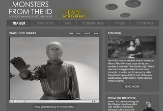 Shows space alien in a space suit extending an open hand in greeting from "The Day the Earth Stood Still" 1951 movie.
