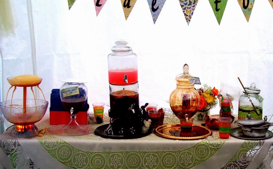 teas, punches and infused waters are served on a lace tablecloth for the bridal shower