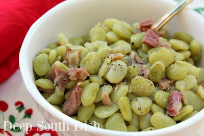 Fresh or frozen baby lima beans or butter beans, slow simmered in a ham hock seasoned broth with onion, chicken base, salt and pepper, and finished with a nob of butter or bacon drippings - a definite summertime southern favorite.