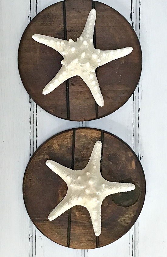 Round starfish plaques on reclaimed wood