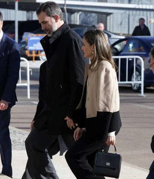 Queen Letizia wore ZARA Cape Jacket, Hugo Boss boots, BOSS Bespoke Bag, Tous earrings