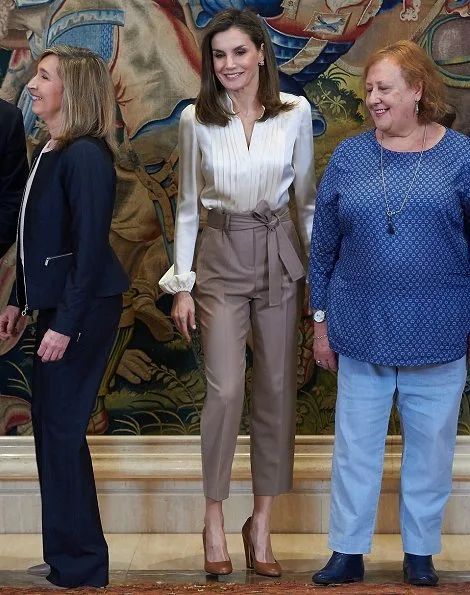 Queen Letizia wore Massimo Dutti darts and tied details Trousers and Uterque Shoes, and Hugo Boss blouse