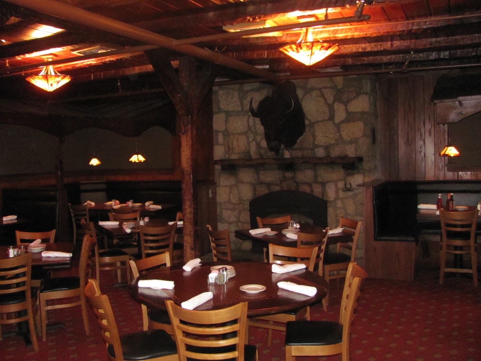 Lensing and Shuttering Lariat Steakhouse dining room buffalo head
