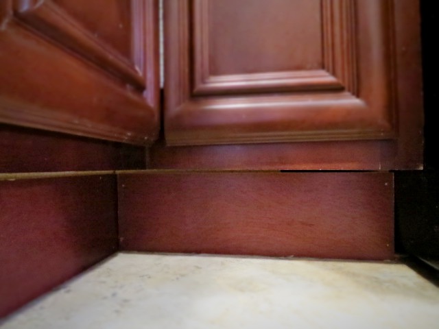 affixing kick plate panel in kitchen