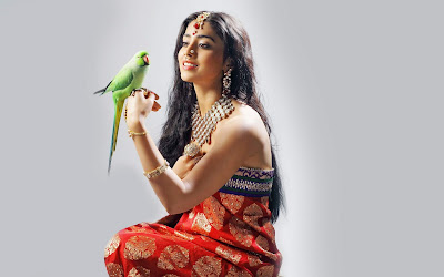 Gorgeous Shriya Saran with green parrot