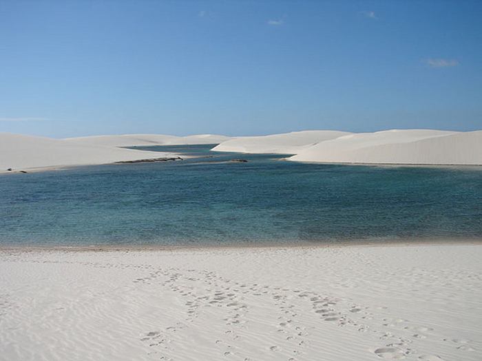 The Lencois Maranhenses National Park Brazil (Parque Nacional dos Lençóis Maranhenses) is located in Maranhão state, in northeastern Brazil, just east of the Baía de São José, between 02º19’—02º45’ S and 42º44’—43º29’ W. It is an area of low, flat, occasionally flooded land, overlaid with large, discrete sand dunes. It encompasses roughly 1500 square kilometers, and despite abundant rain, supports almost no vegetation. The park was created on June 2, 1981. It was featured in the Brazilian film The House of Sand. Most recently, it was featured in the song "Kadhal Anukkal" from the Indian film, Enthiran.