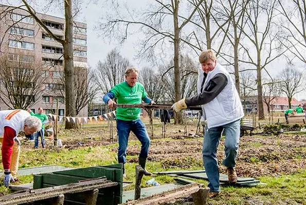 National Volunteer day, King Willem-Alexander and Queen Maxima volunteering for NL Doet in the neighborhood garden in Breda