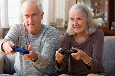 0 Senior couple playing video game