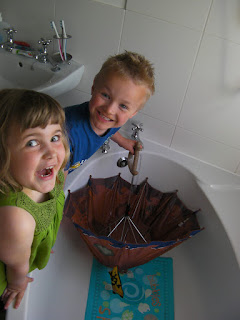 filling up an umbrella in the bathtub