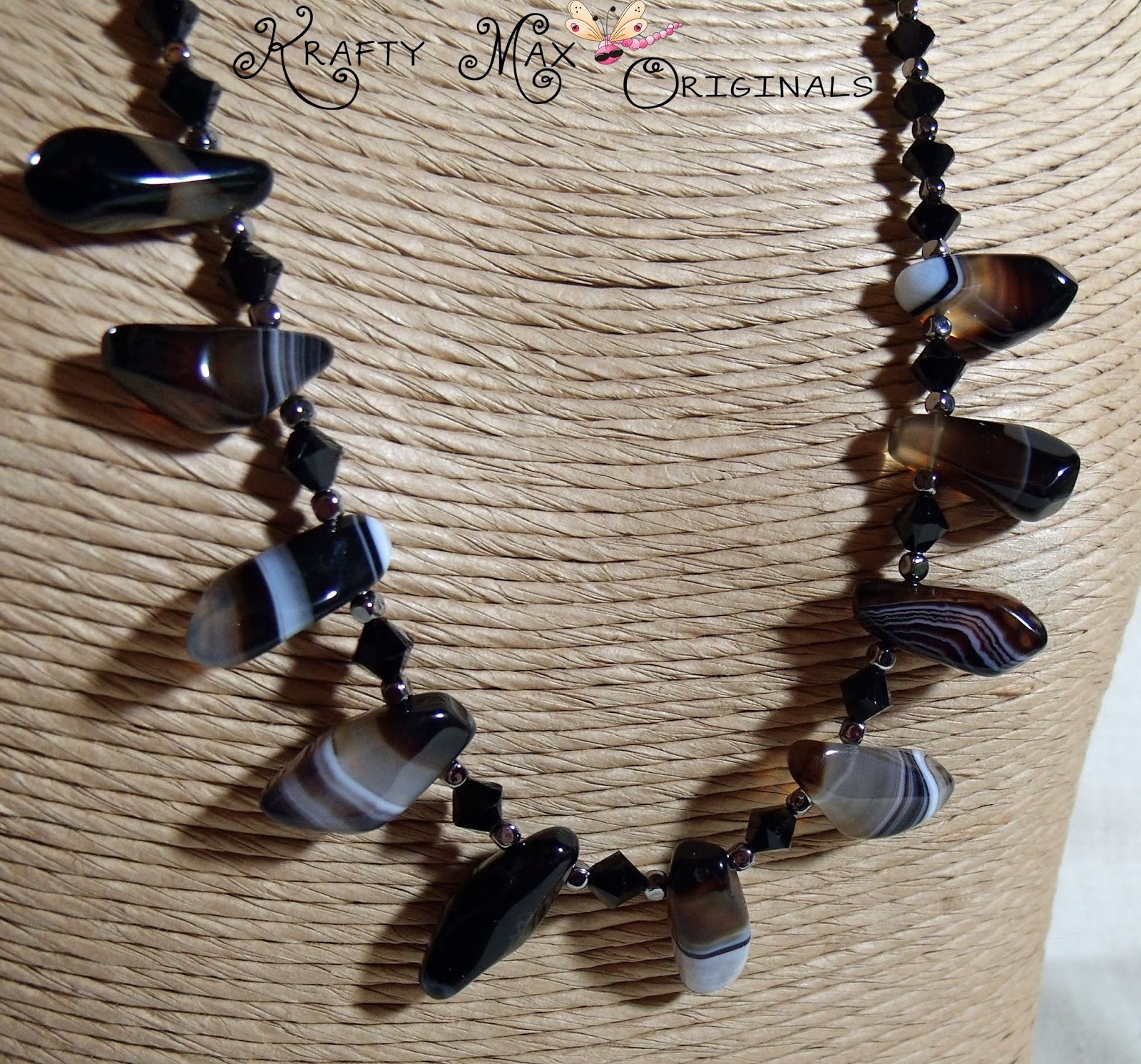 http://www.lajuliet.com/index.php/2013-01-04-15-21-51/ad/gemstone,92/exclusive-black-banded-agate-and-swarovski-crystals-necklace-set-a-krafty-max-original-design,128