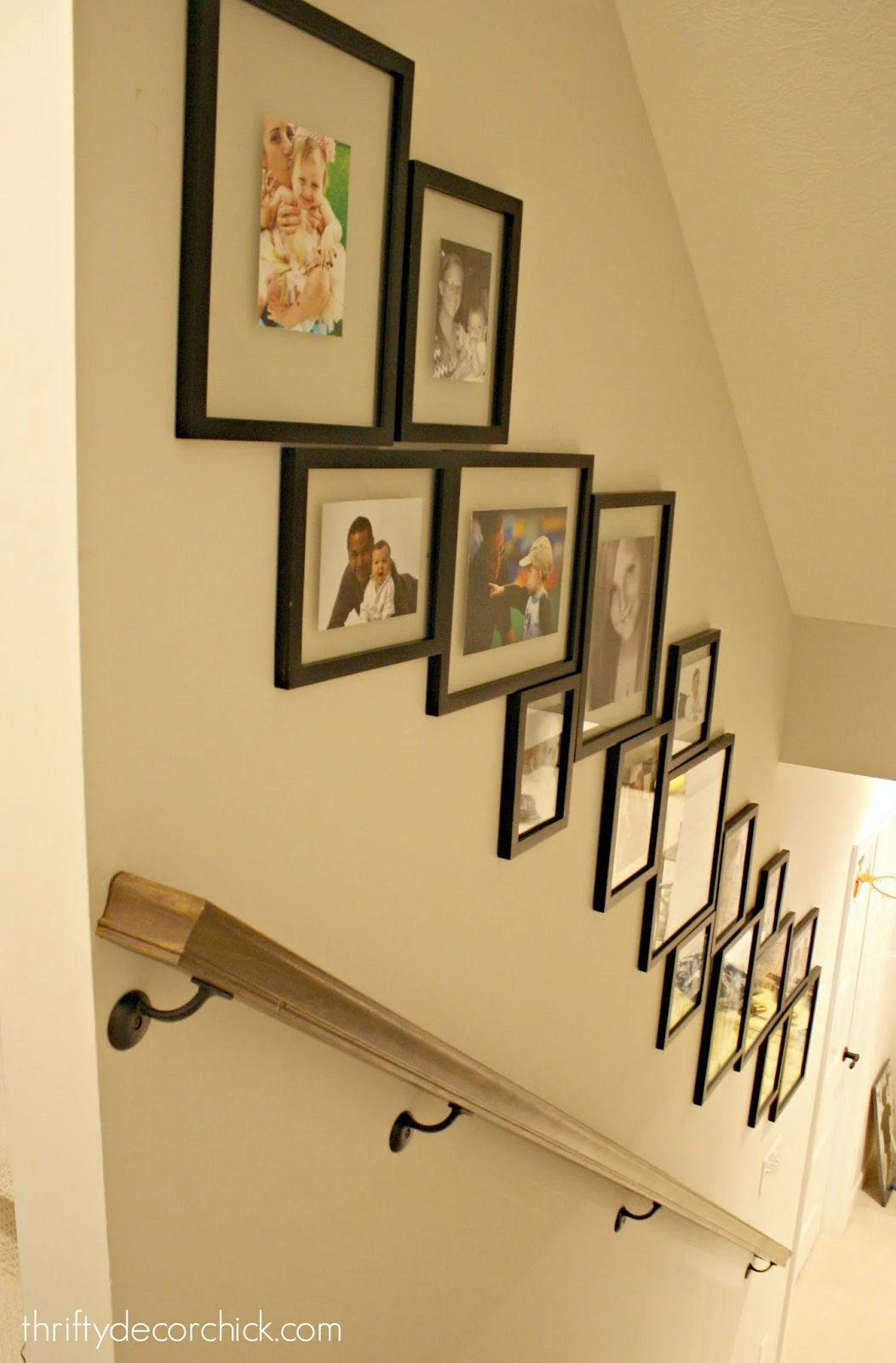 Gallery wall with design going down the stairs