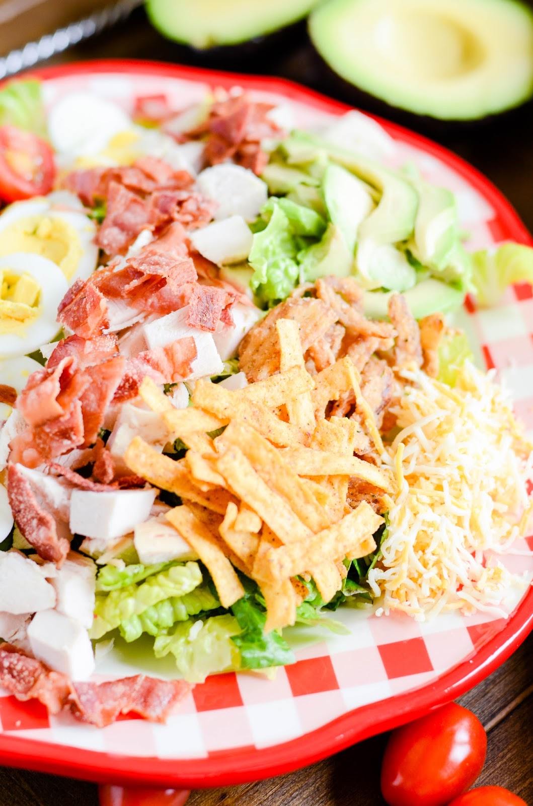 Perfect for warm weather, parties, lunch, and dinner! Crunchy, creamy, and just a little bit spicy BBQ Chicken Cobb Salad.