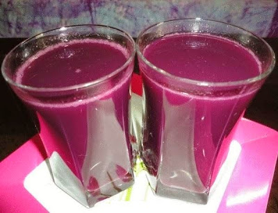 black grape juice in serving glasses