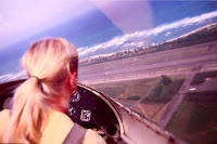 This is the story of the blonde flying in a two-seater airplane with just the pilot