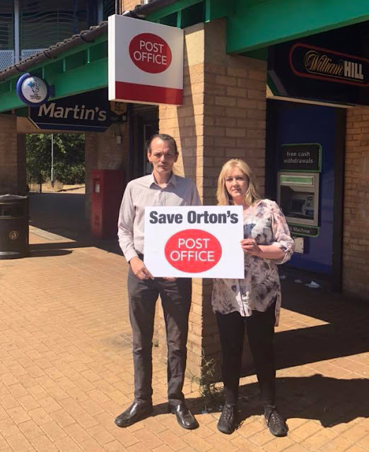 Alex with Peterborough City Councillor Julie Howell outside the post office in Herlington.